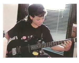 In 1991 playing my Rok Axe electric guitar. 